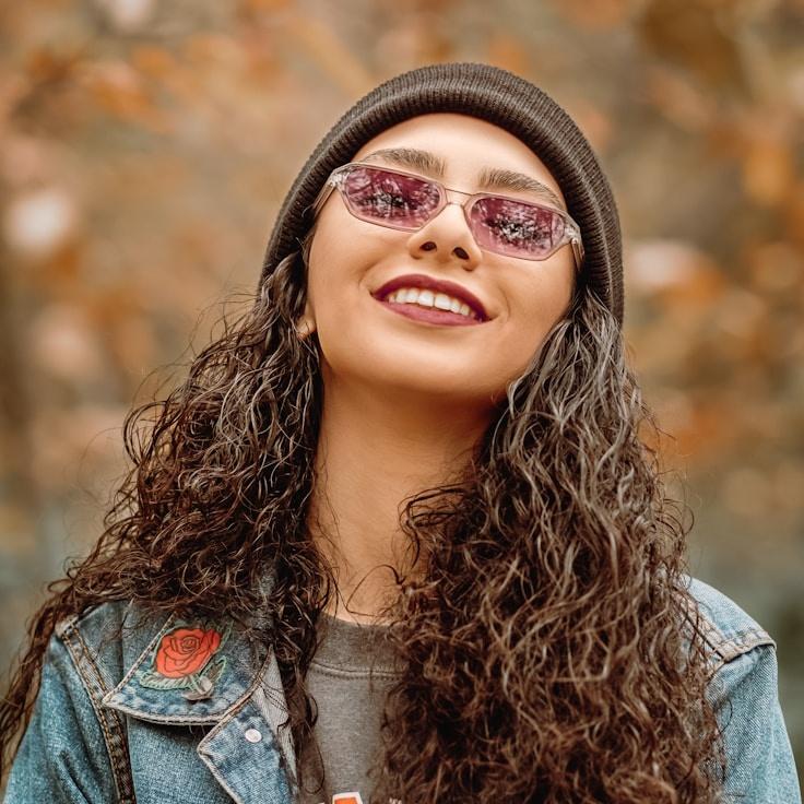 Kaveri Mehta, Lead Design Curator at Harvest Quay Quarry, reviewing corporate floral arrangements